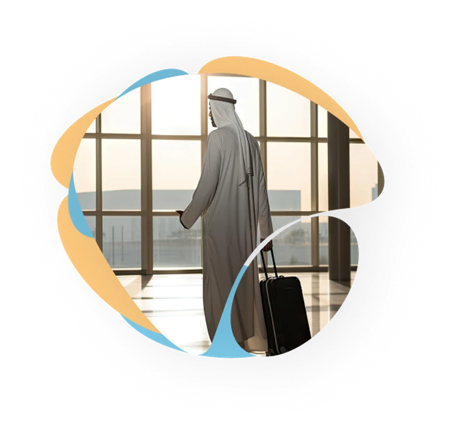 Business traveller with luggage heading through an airport